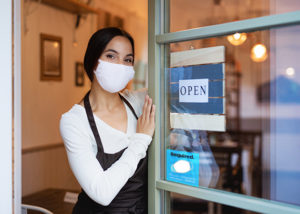 Business owner with mask