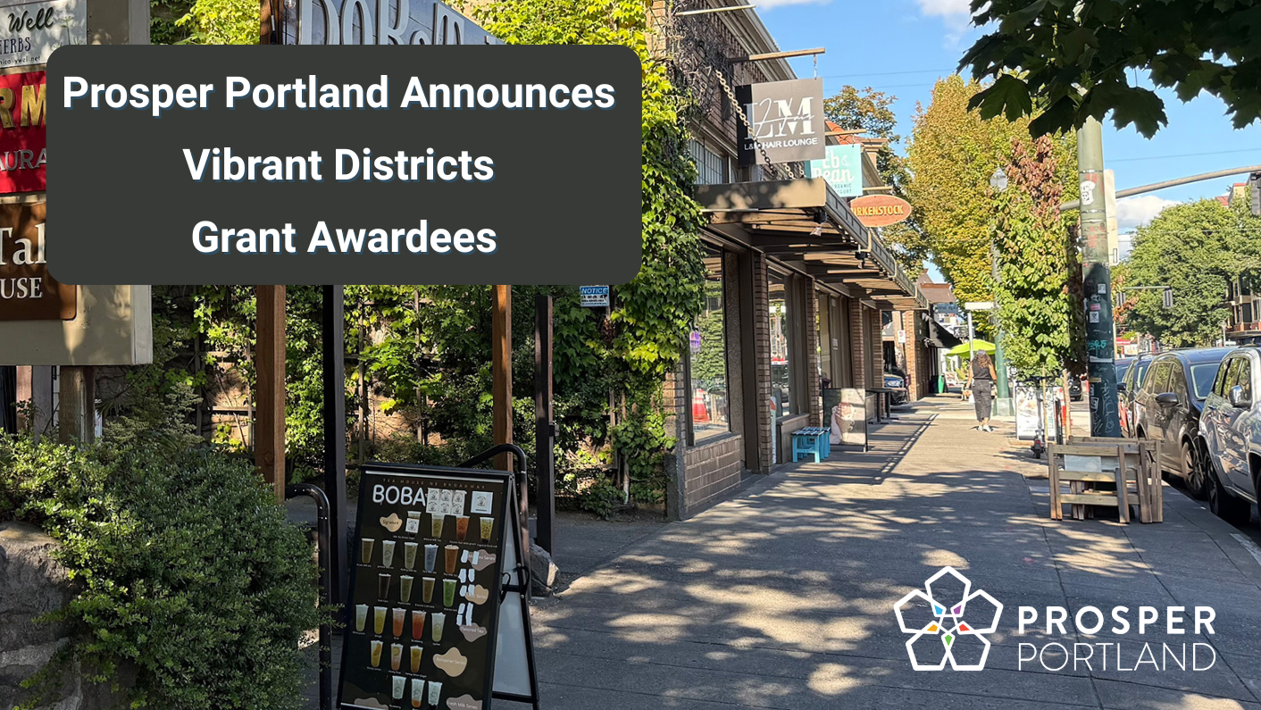 Prosper Portland announces Vibrant Districts Grant Awardees. An image in the background shows a street (NE Broadway) with trees and small businesses.