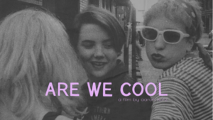 A black-and-white photo of three people, one of whom is wearing sunglasses. The caption says 